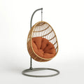 Rattan Hängesessel mit Orangefarbenen Kissen und Stahlrahmen